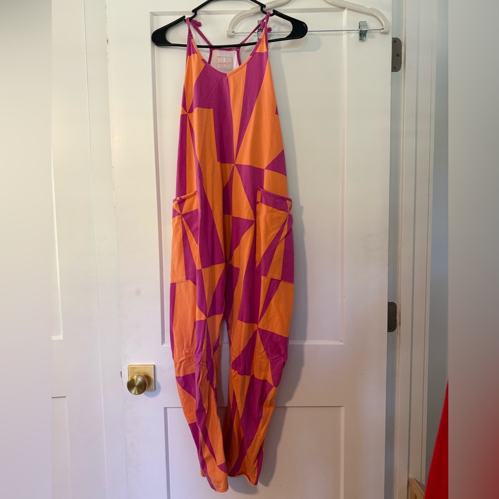 HOT SHOT ONSIE Free People Orange and Pink Geometric Jumpsuit. Only worn once